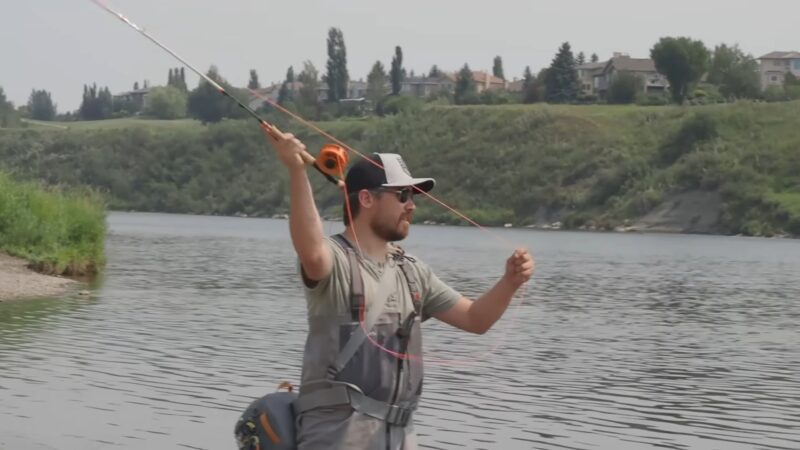 man fly fishing