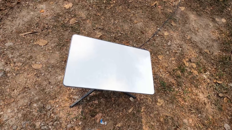 Starlink Roam dish set up on bare ground in a remote area for satellite internet access