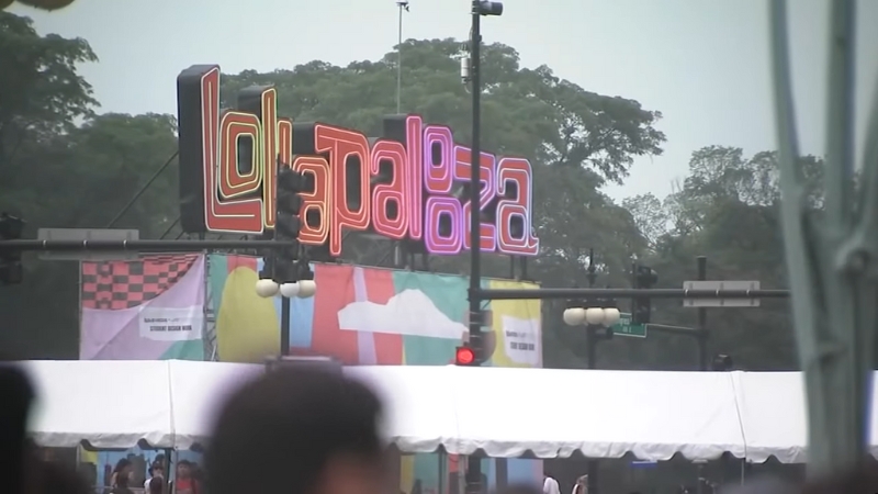 Crowds gather near the entrance sign at Grant Park for Lollapalooza 2025 in Chicago