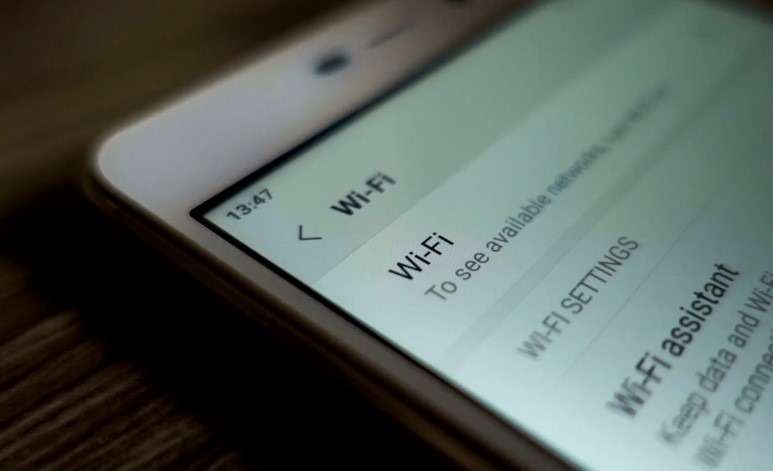 Close up view of a mobile phone display, showing Wi-Fi options