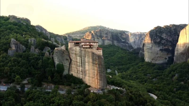 A monastery on a cliff in Meteora, Greece, offering a peaceful summer escape in Europe
