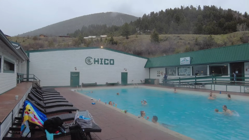 People relax and swim in the large outdoor geothermal pool at Chico Hot Springs Resort & Day Spa in Pray, Montana