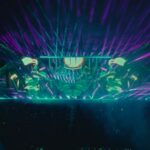 The main stage at Lost Lands Festival 2025 lights up with lasers, vibrant visuals, and a packed crowd at night