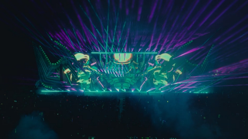 The main stage at Lost Lands Festival 2025 lights up with lasers, vibrant visuals, and a packed crowd at night