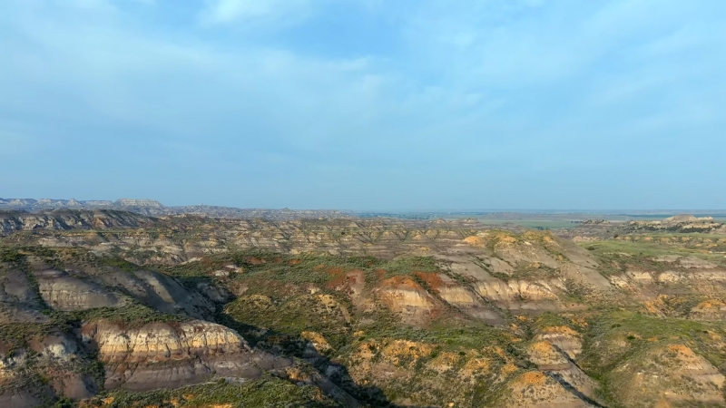 Wide view of layered buttes and dry gullies in the Terry Badlands Wilderness Study Area in eastern Montana