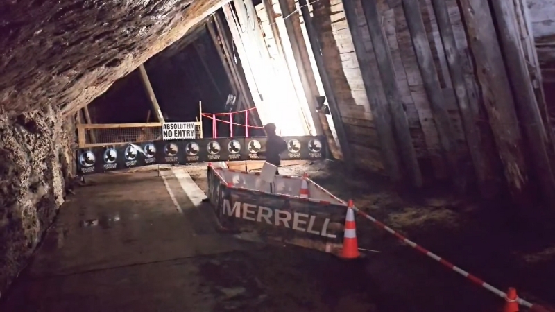 Runner in the Bellevue Underground Mine during The Dark 24-hour race in Crowsnest Pass