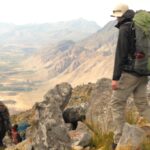Backpackers on a high mountain trail during a backpacking trip for a large group