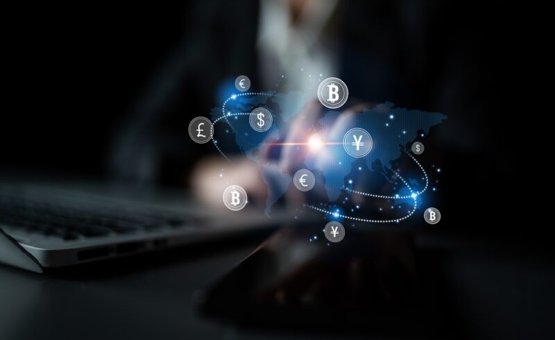 Digital map with global currencies and payment icons representing international transactions